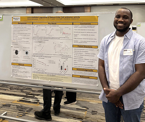 Etinosa Osamudiamen with his poster